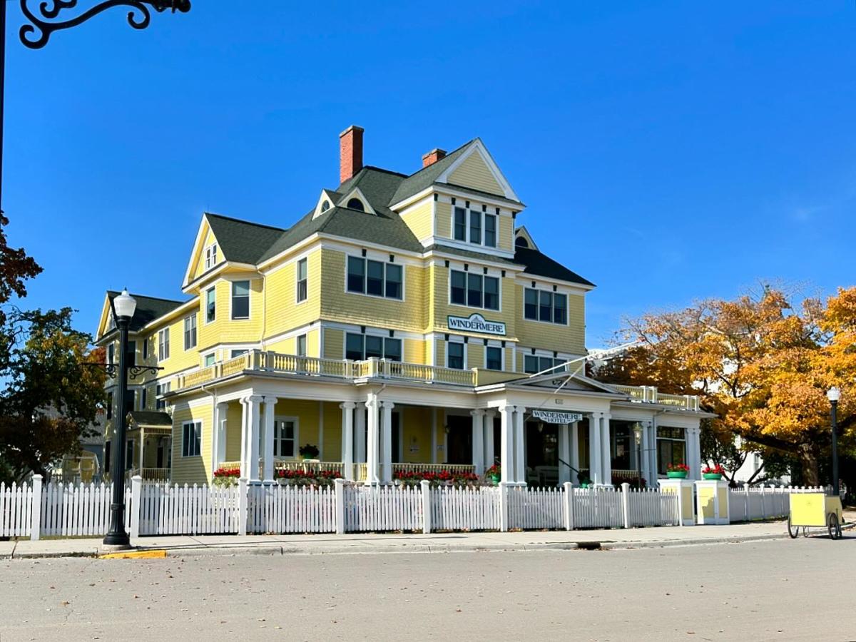 The large, yellow Windermere Hotel stands along Main Street on Mackinac Island