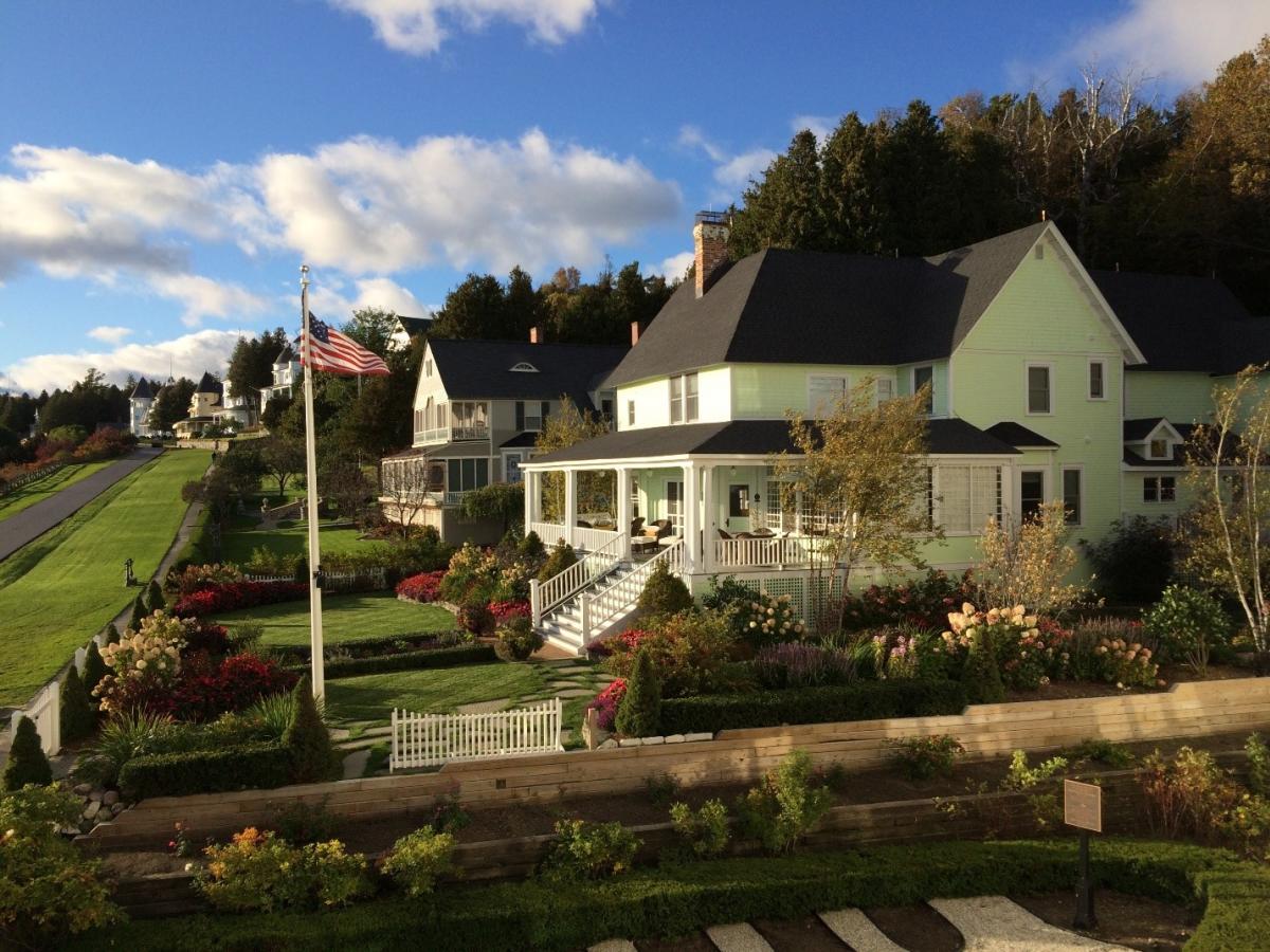 Yellow Mackinac Island cottage on the bluff at sunset