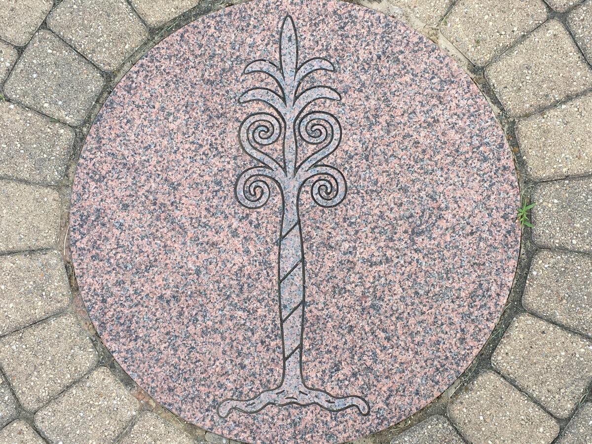 A design etched into a stone pathway