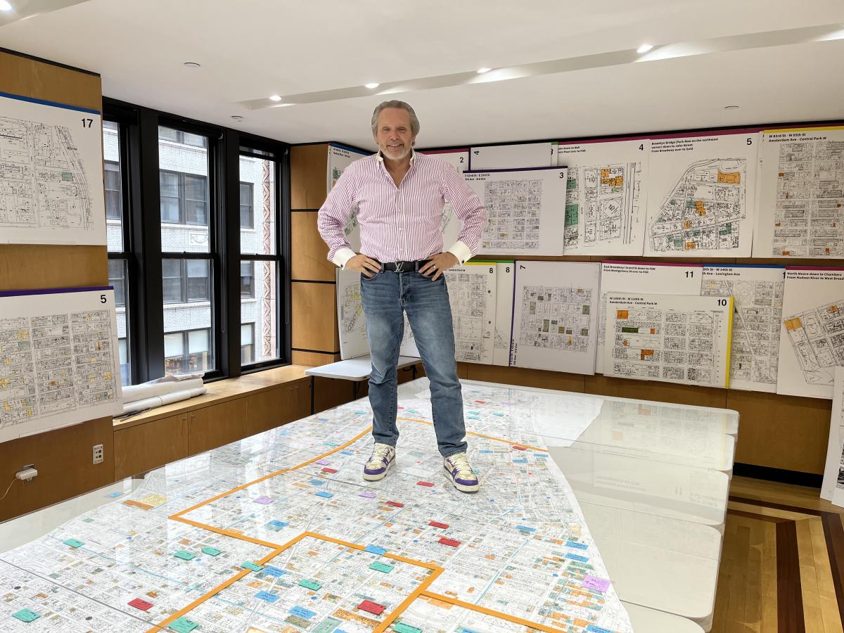 Bob Knackal Standing on New York City Map