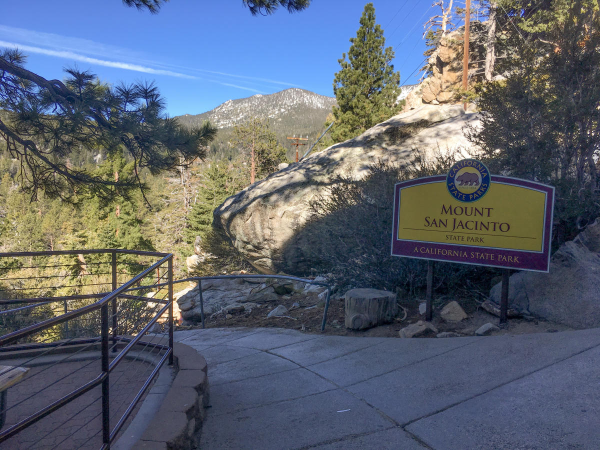 A steep paved walkway near a sign for the Mount San Jacinto State Park