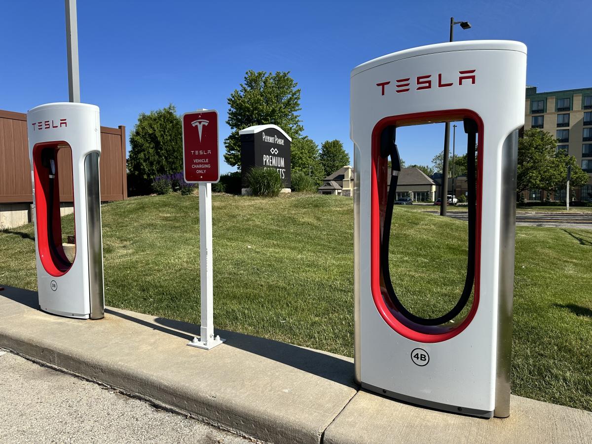 Image of a Tesla Supercharger for Tesla vehicles, located within the Pleasant Prairie Premium Outlets, near the Doubletree Hotel.