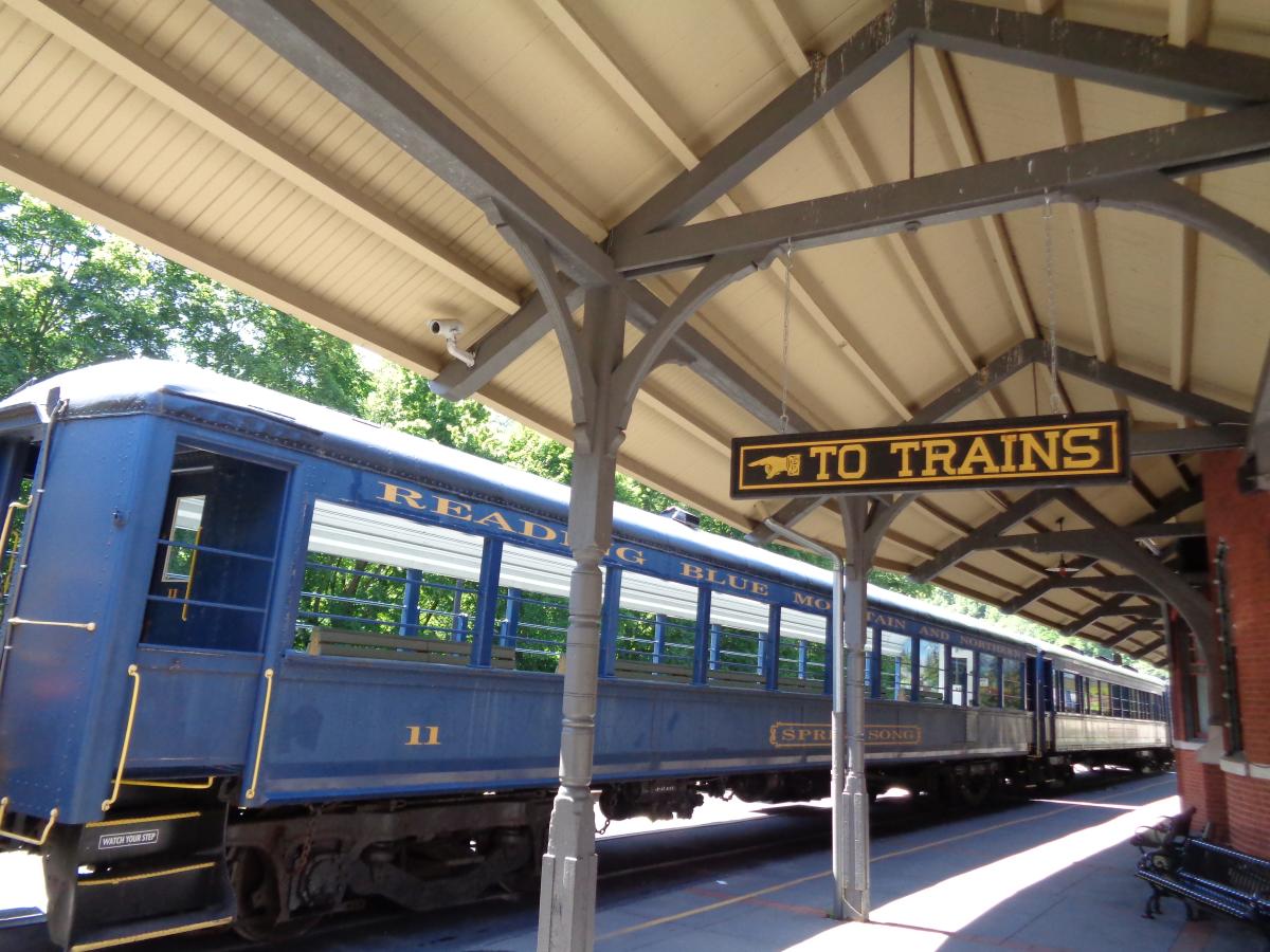 A train sits at the station waiting for the next ride.