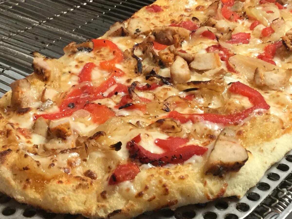 Pizza with toppings from Third Base Pizza Parlor