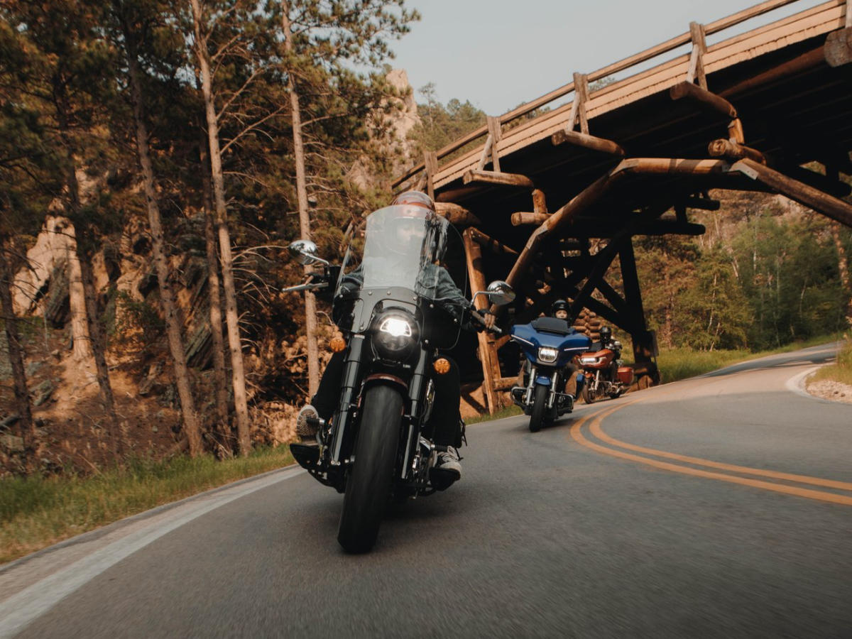 motorcycles taking the corners of the pigtails on iron mountain road in the black hills