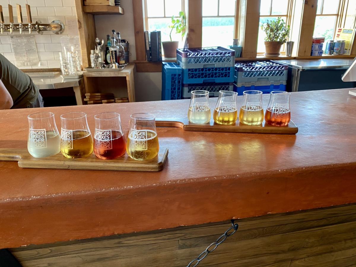 Finger Lakes Cider House beer flights with a selection of different colorful ciders and beers