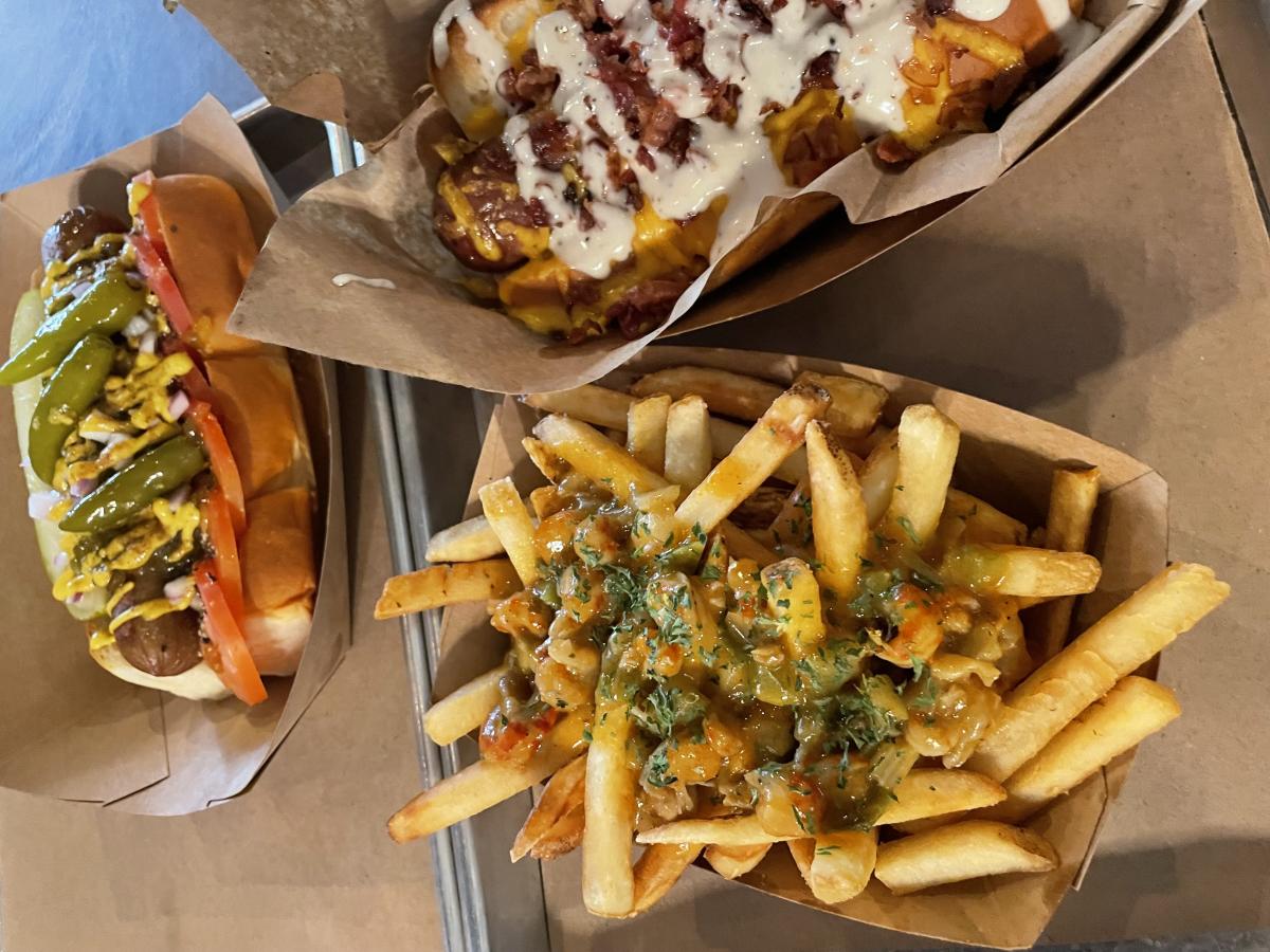 A photo of fries and two hot dogs from The Missing Link