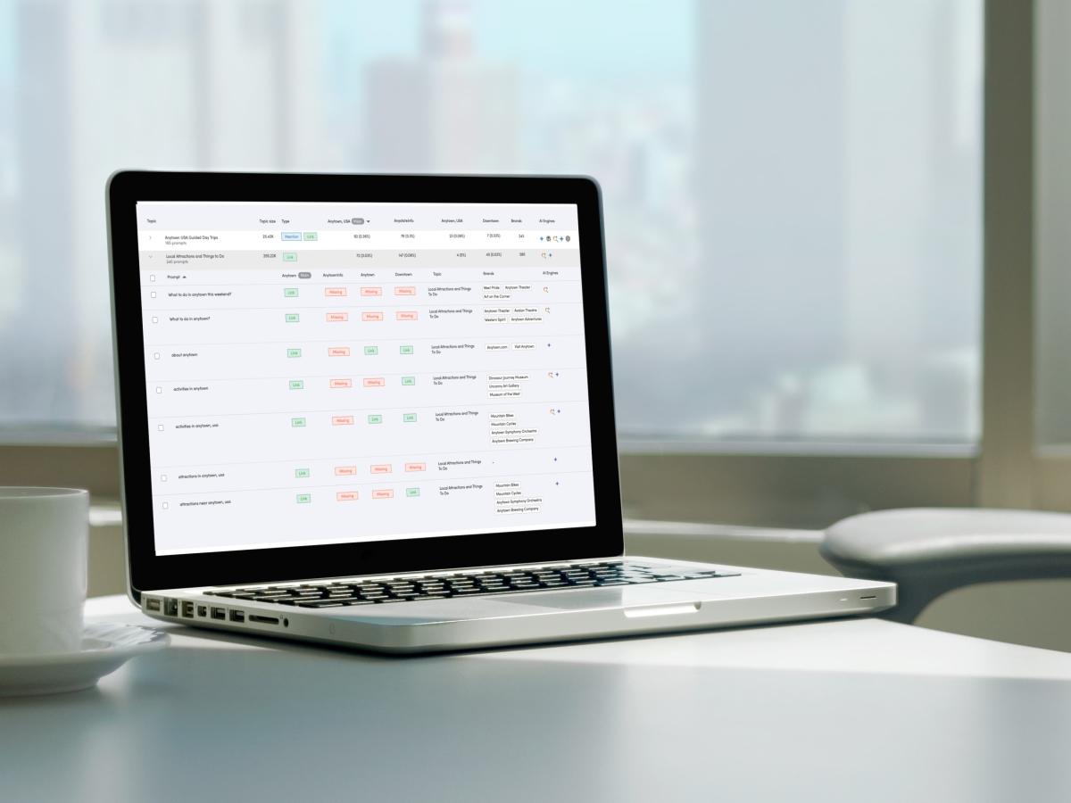Search and Visibility reporting dashboard open on a laptop.