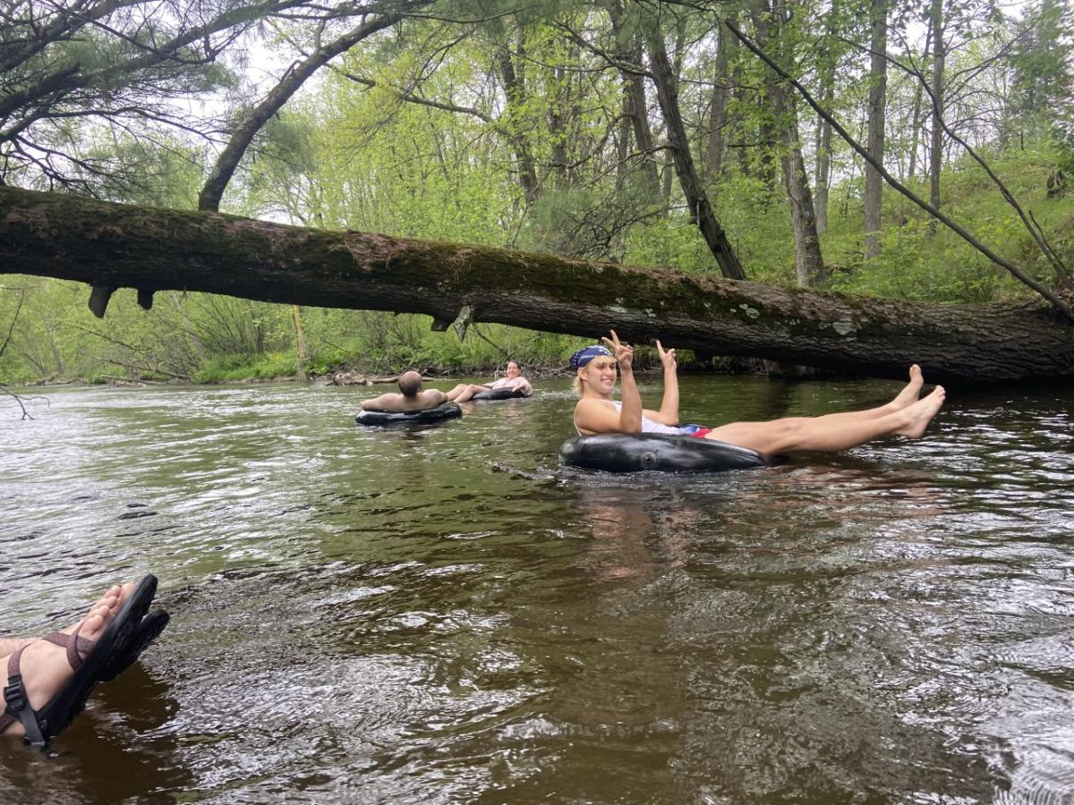 A group of friends tube the beautiful Tomorrow River.