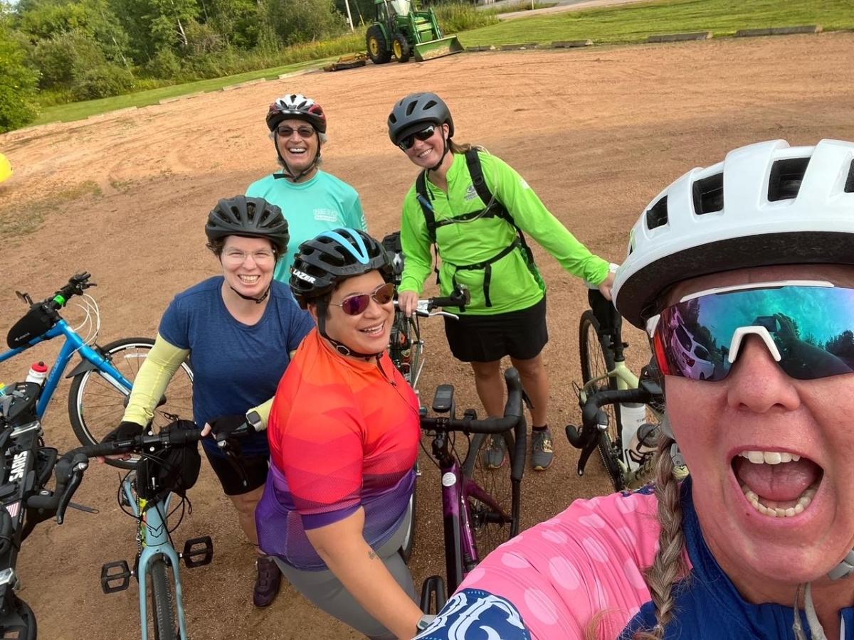 A group of women coming together and biking in the Stevens Point Area.