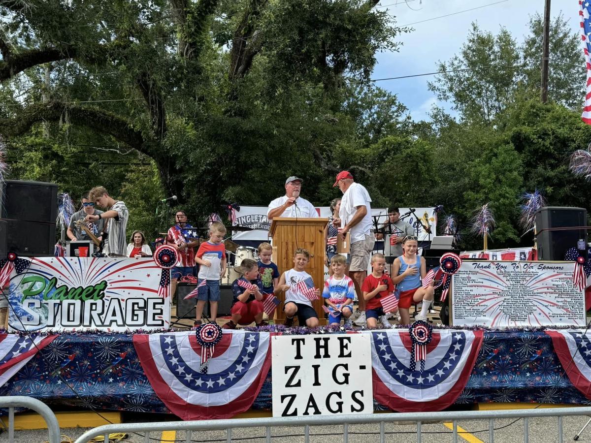 Pearl River Independence Day Celebration volunteers and children onstage, July 2024.