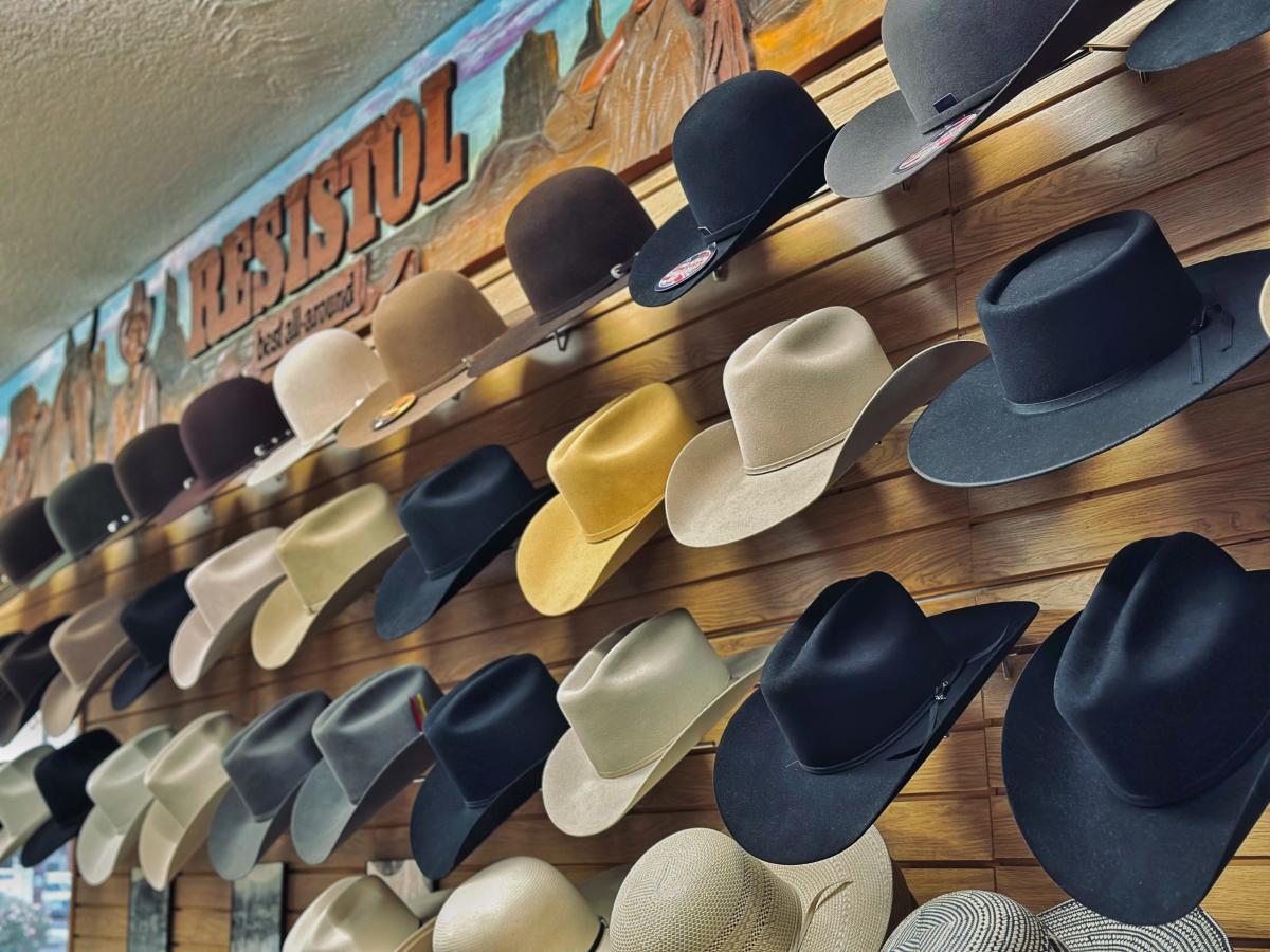 Wall with rows of displayed cowboy hats