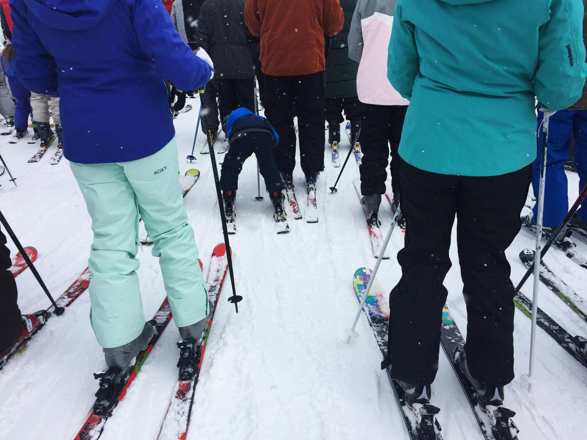 Crowd of Skiers waiting in line for ski lift