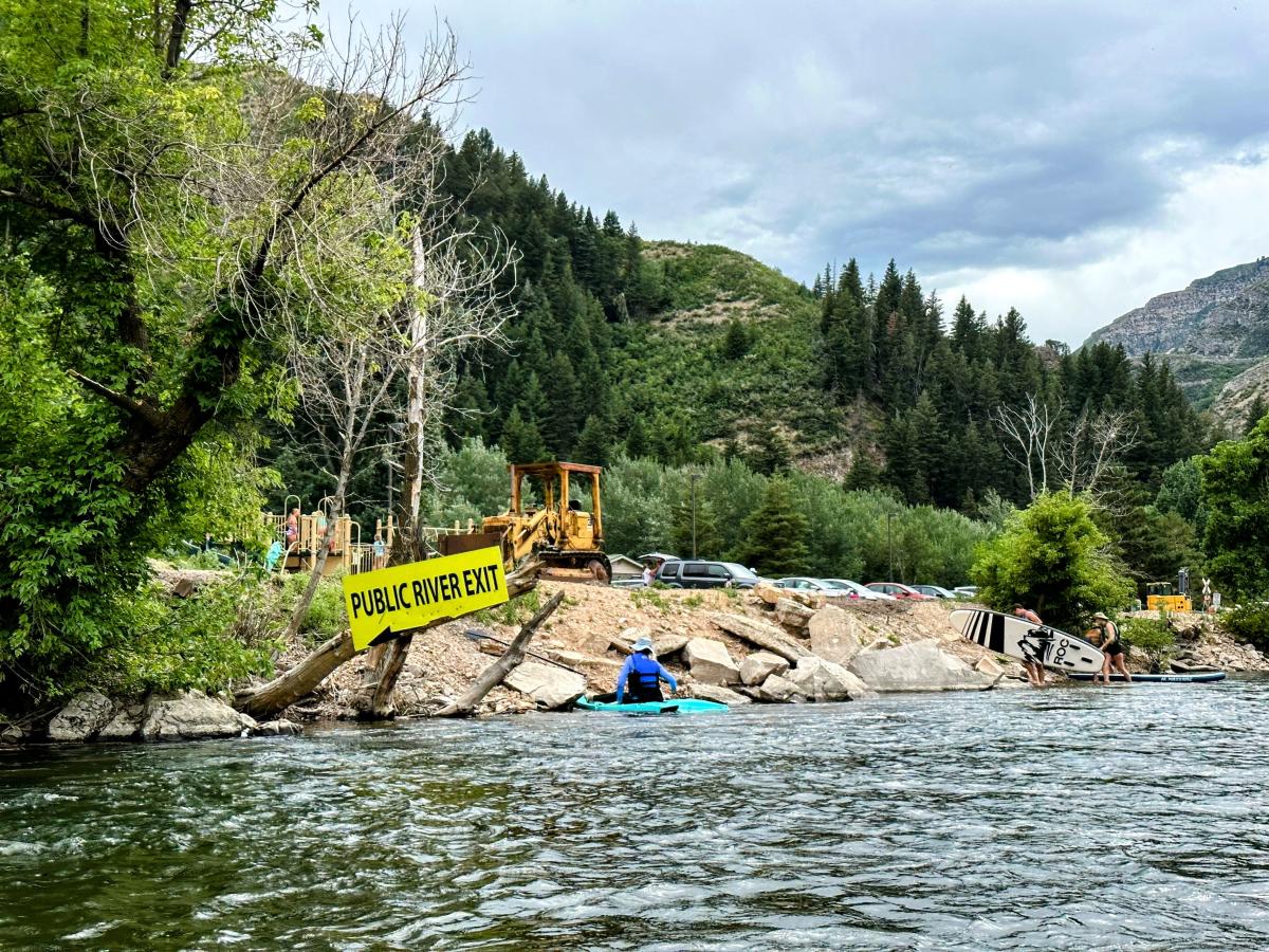 Vivian Park with a yellow sign saying Public River Exit