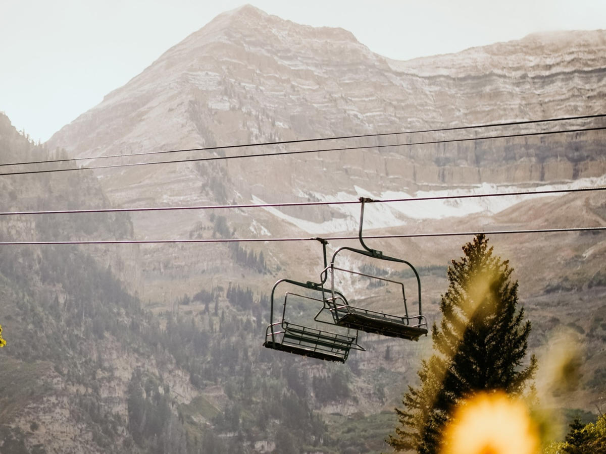 Chair lifts with mountains in the background