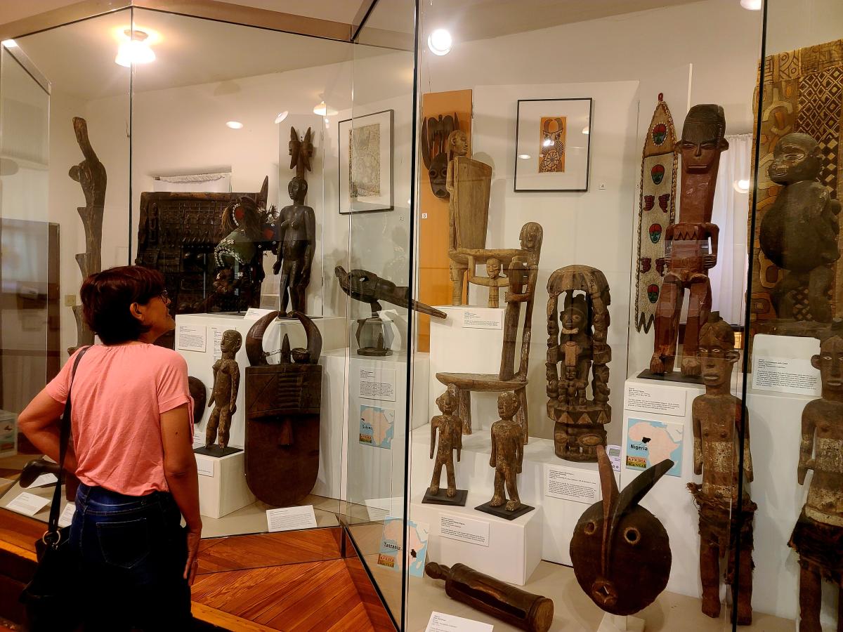 A woman looks at artifacts on display at the Kansas African American Museum