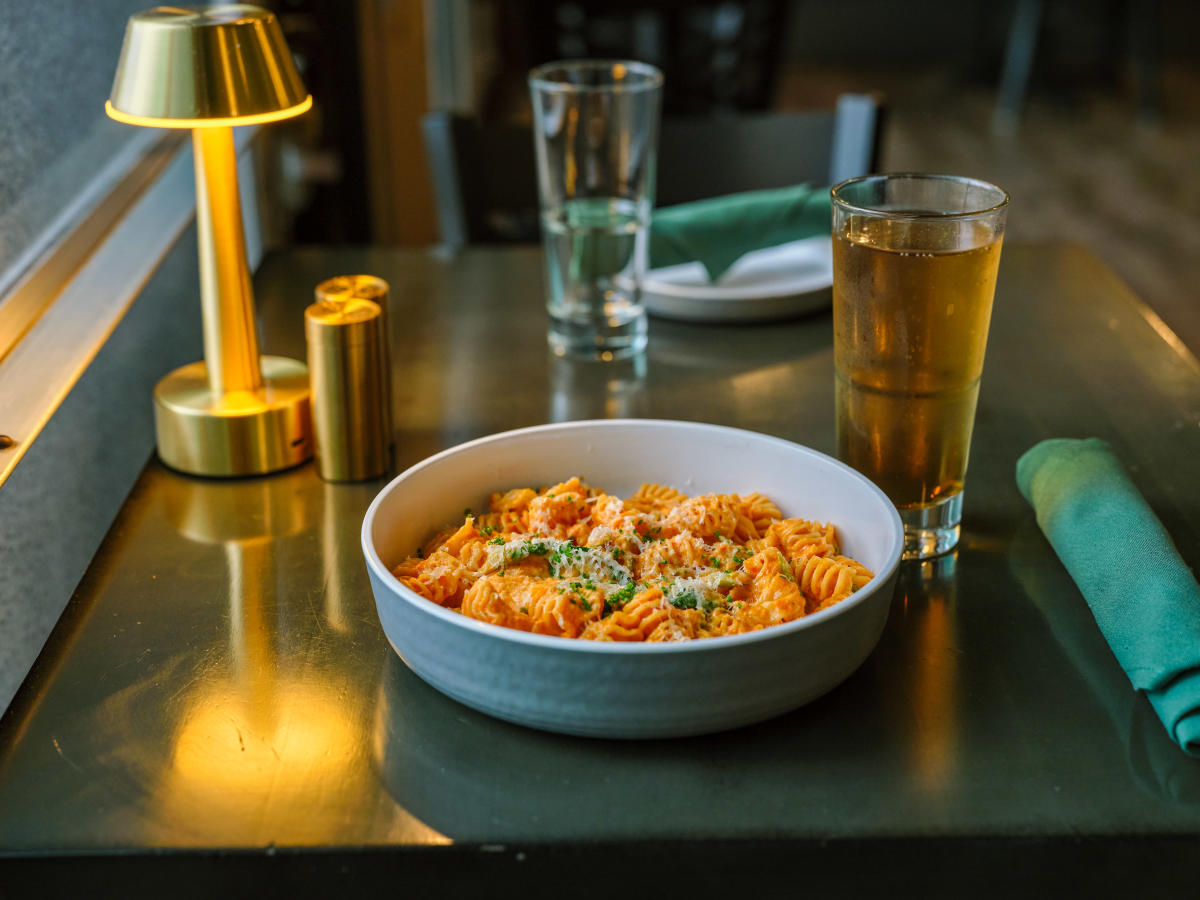 A bowl of pasta is served with a beer at FioRito Ristorante in Wichita.