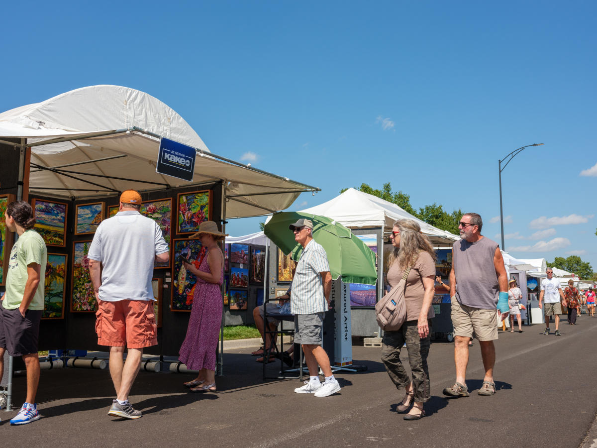 People shop at booths at Autumn & Art