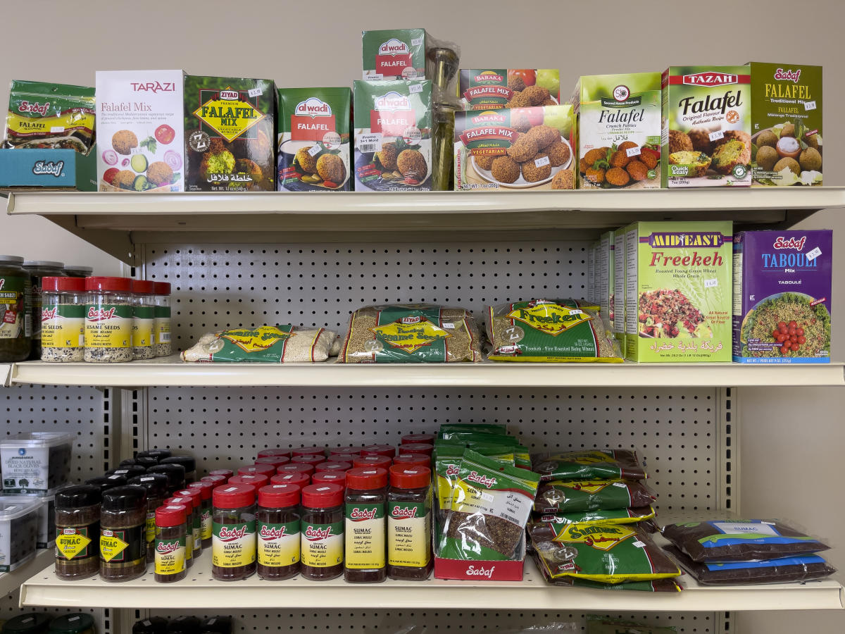 Grocery items are displayed for sale on shelves at N&J Global Market in Wichita