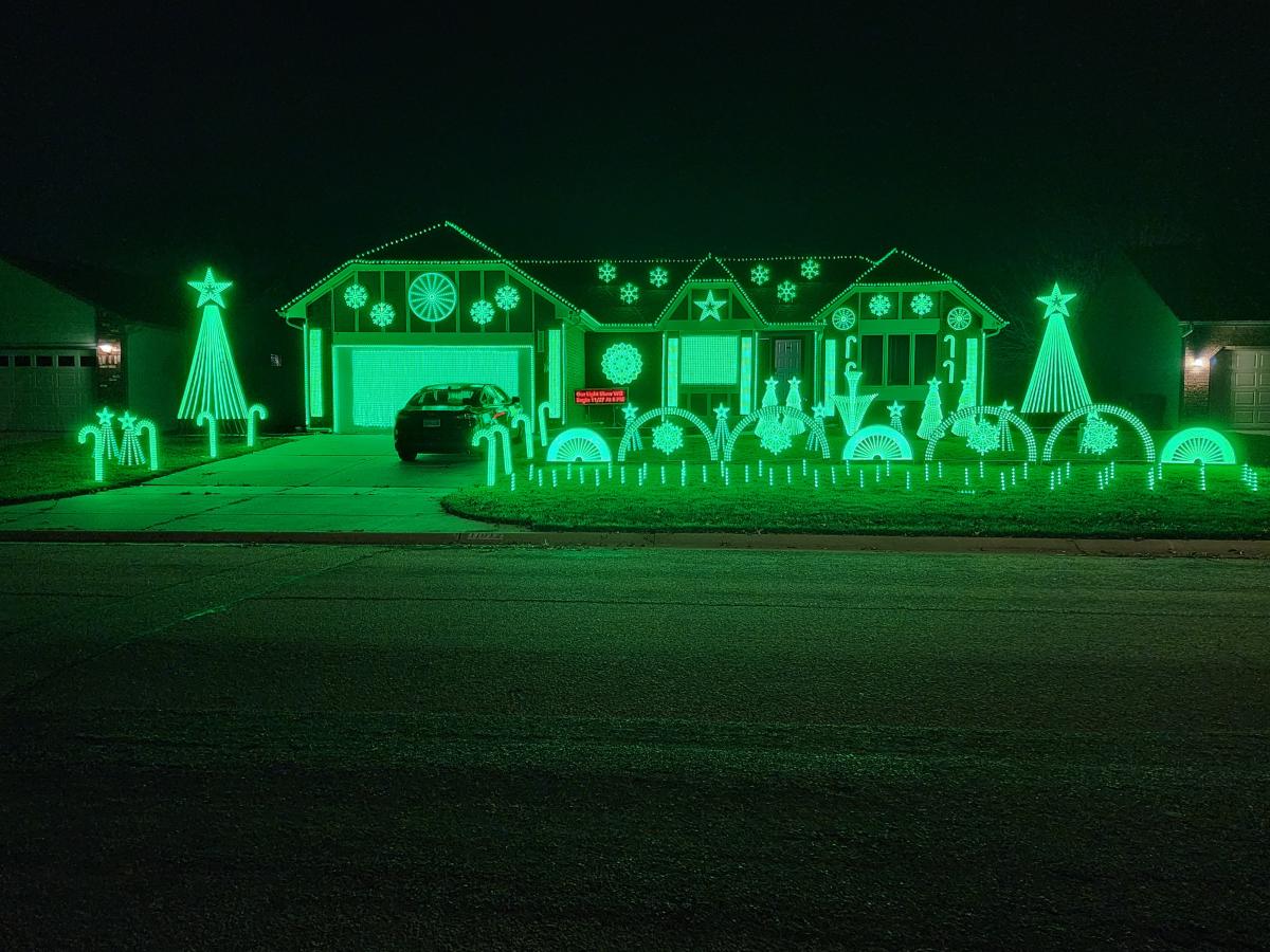 Green Christmas lights illuminate a home on Jennie Street in Wichita.
