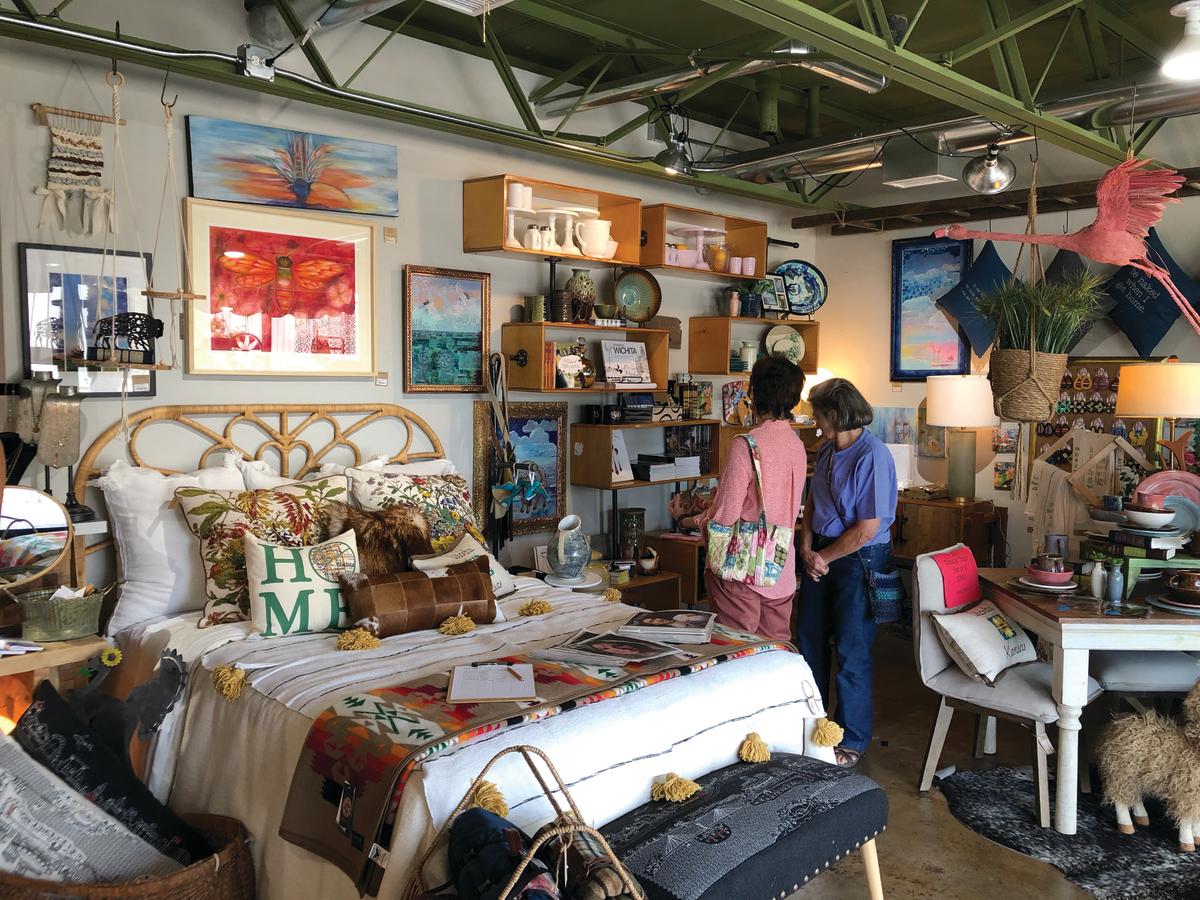 Two patrons shop at Workroom in the Douglas Design District