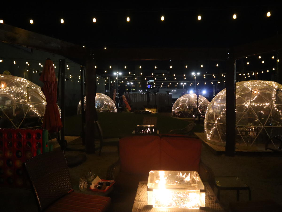 Igloo tens are illuminated by interior lights on the patio at Nortons