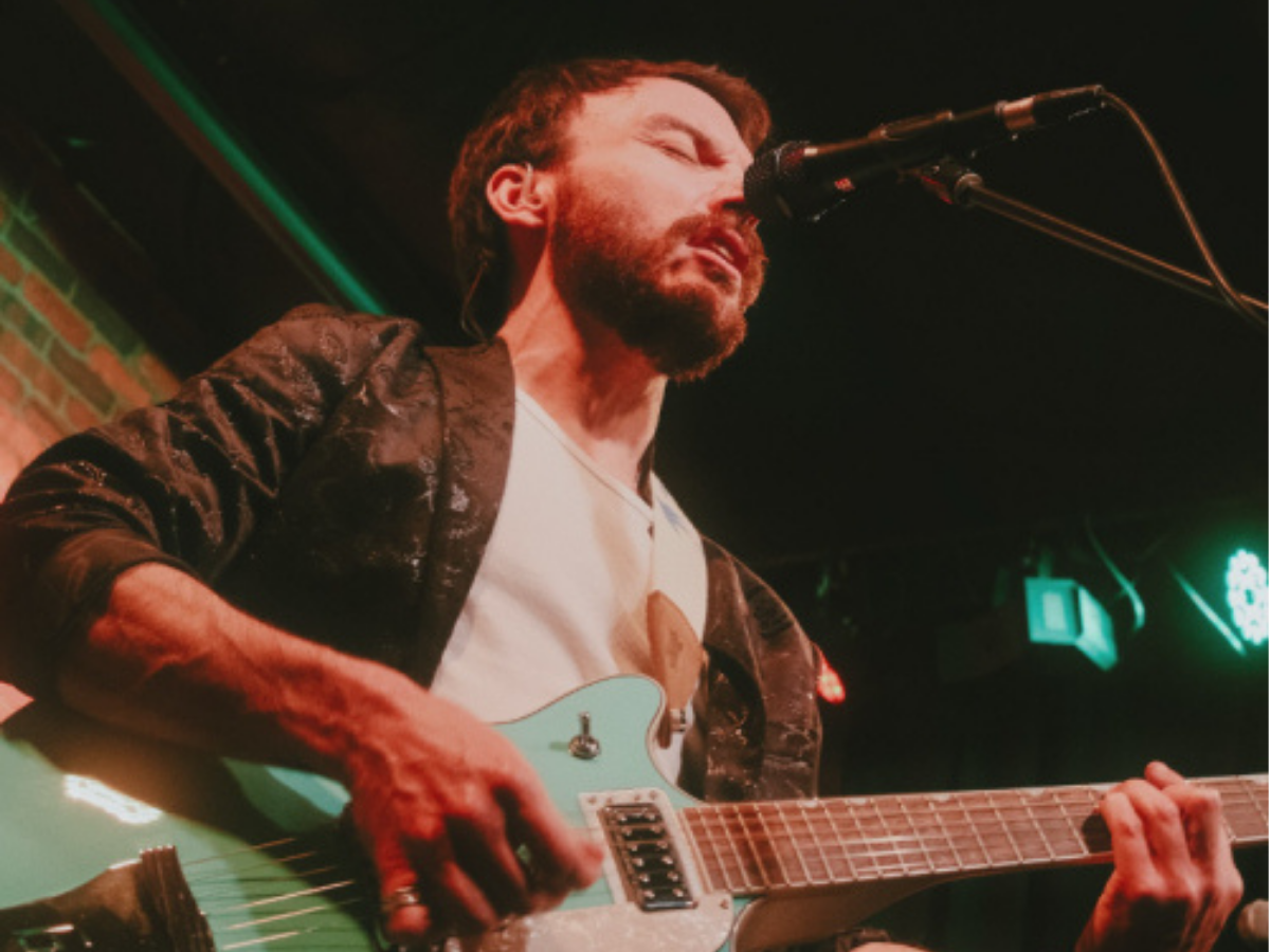 Guys playing the guitar