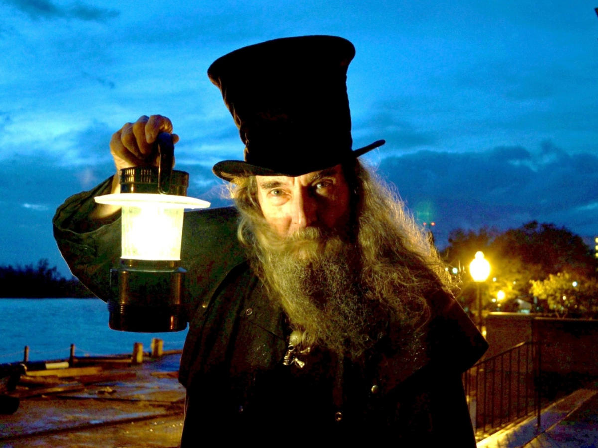 Ghost Walk tour guide holding a lantern