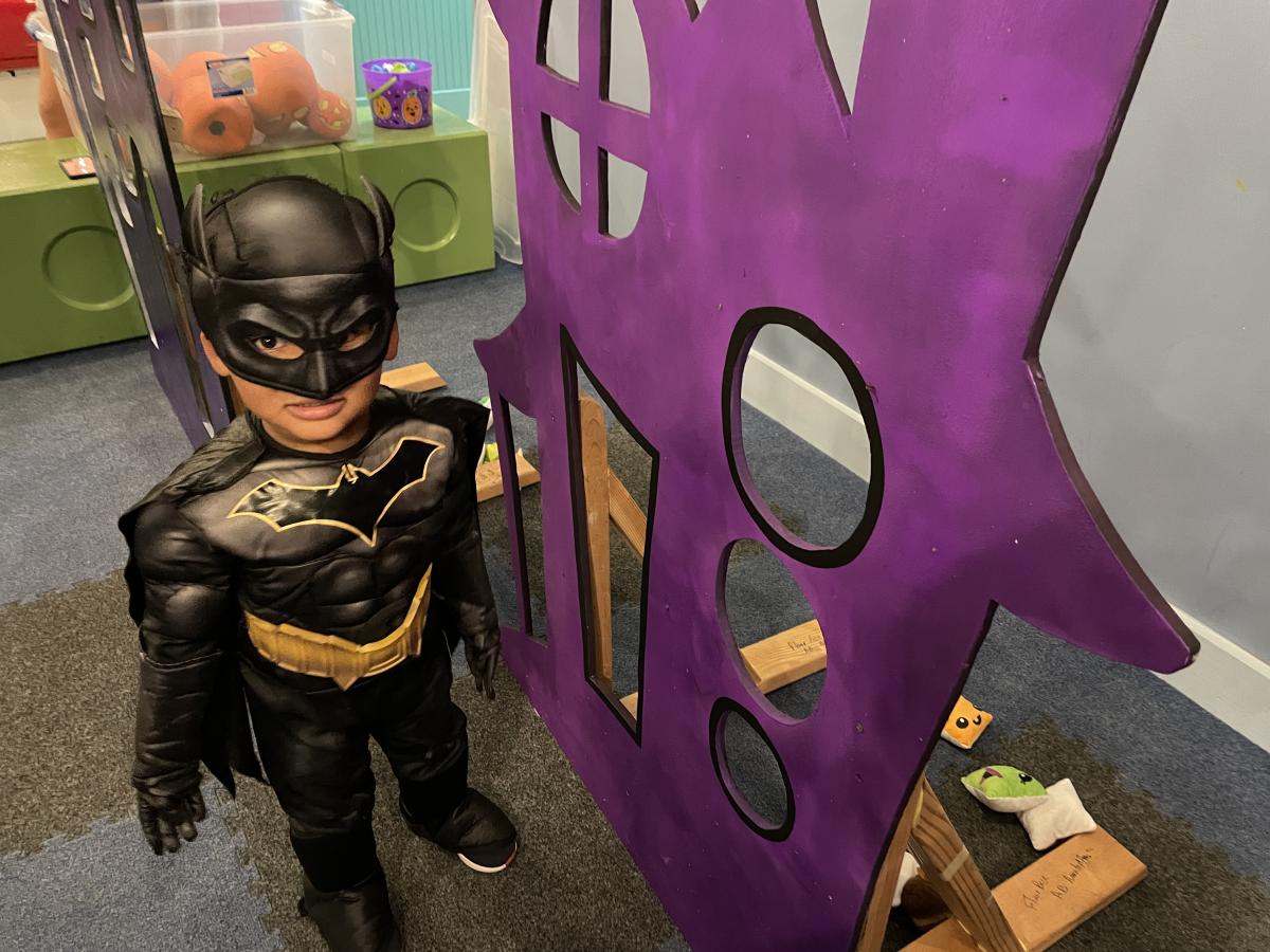 Boy with Batman costume at The Children's Museum SpookTacular Event