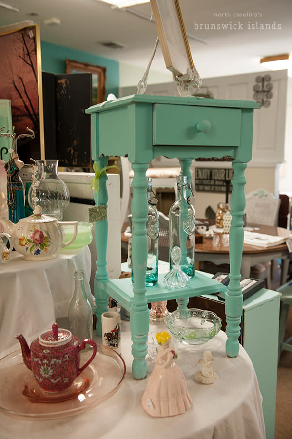 a mint green nightstand for sale at an antique store in shallotte, nc