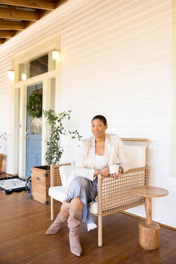 Jihan Bradford, owner of Lavender Hill Bed & Breakfast, sits on the porch of her B&B.
