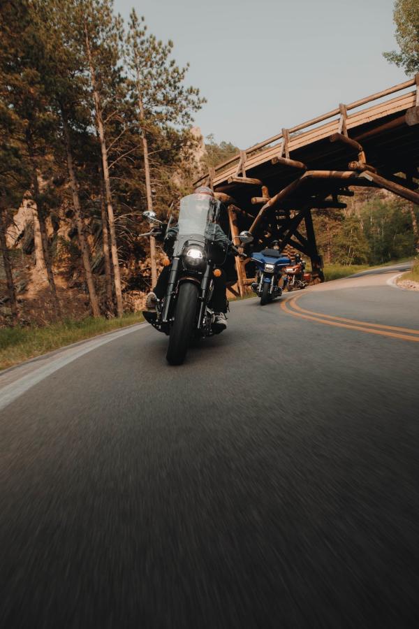 motorcycles taking the corners of the pigtails on iron mountain road in the black hills