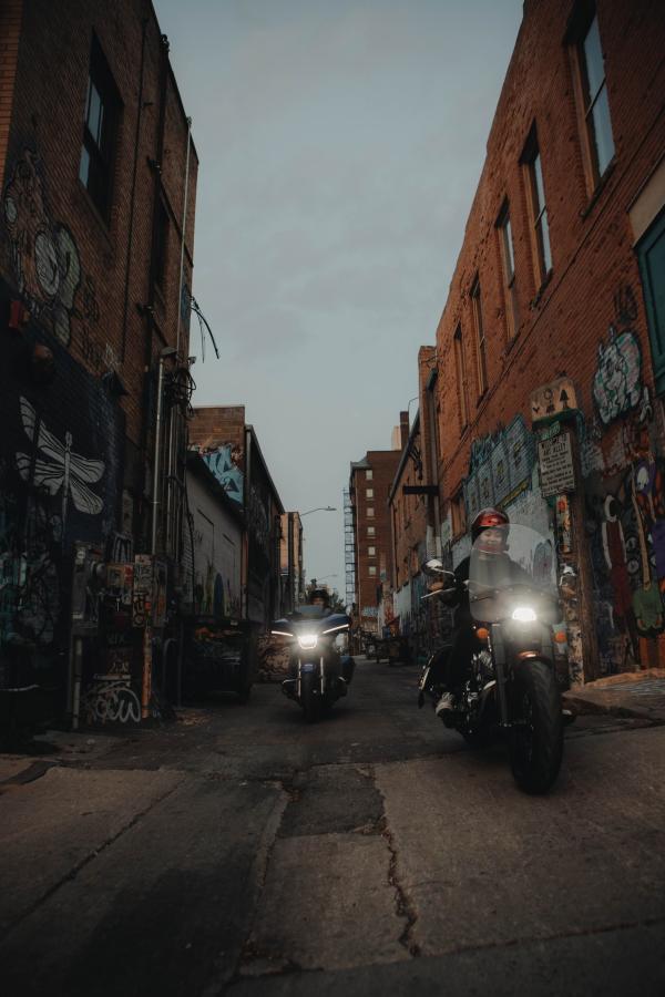 bikers driving through art alley in downtown rapid city, sd