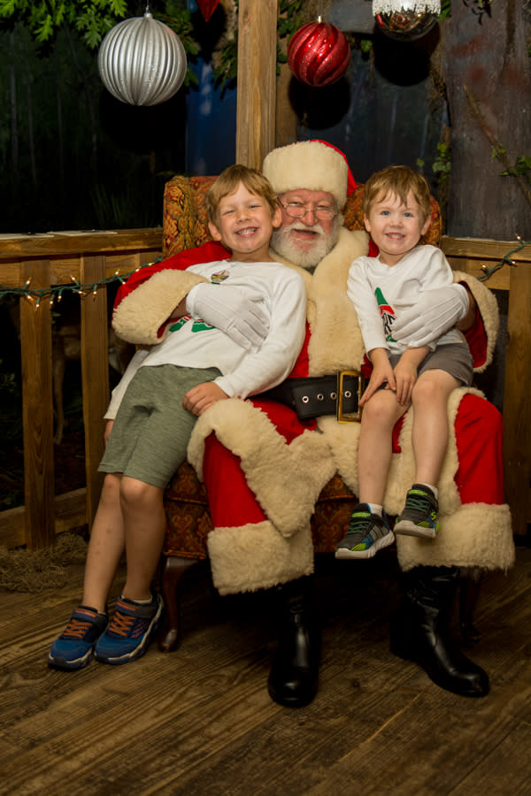 Pictures with Santa at Cajun Christmas at the Bayou Lacombe Visitor Center