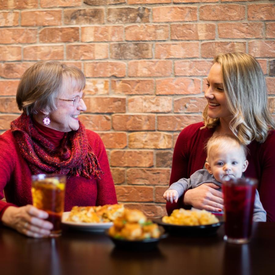 A family enjoys a meal at Flying Star