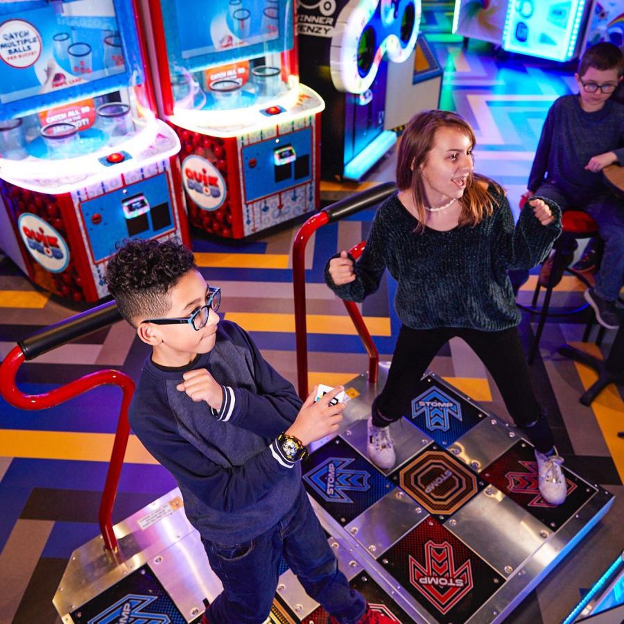 Two people play Dance Dance Revolution at Main Event
