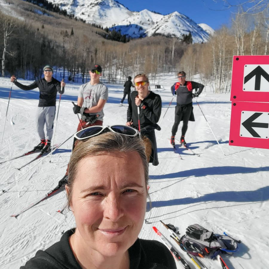 Carri Ward selfie with family family behind