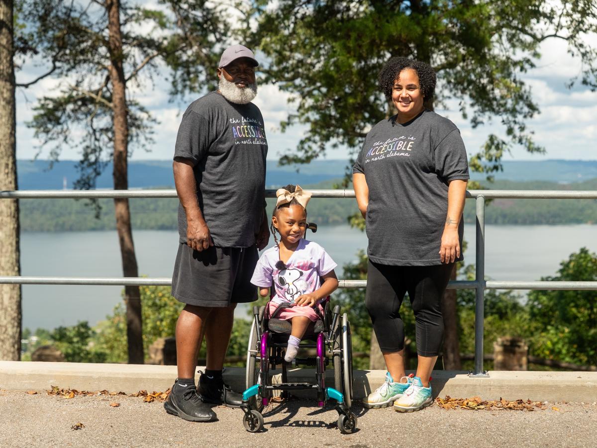 Family with child in wheelchair at a beautiful overlook Bobo Accessible Trail