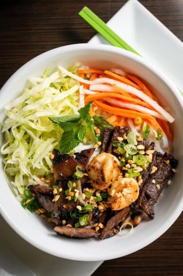 bowl of food with beef, shrimp and vegetables