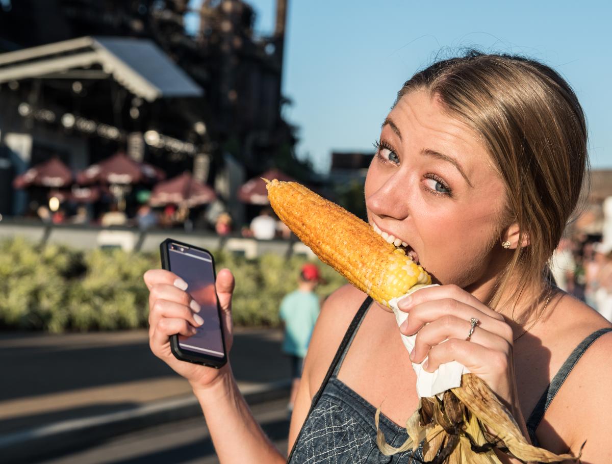 A woman eats Aw-Shucks corn at Musikfest, Lehigh Valley, PA