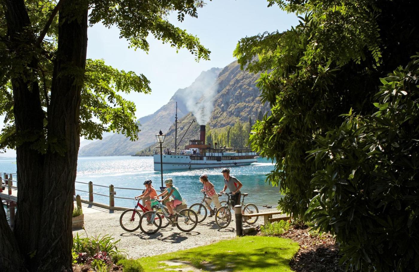 Cycling at Walter Peak with the TSS Earnslaw Steamship in the background