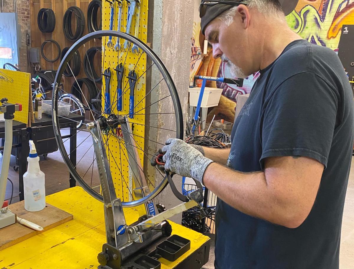 Man working on bike at Pedal Factory