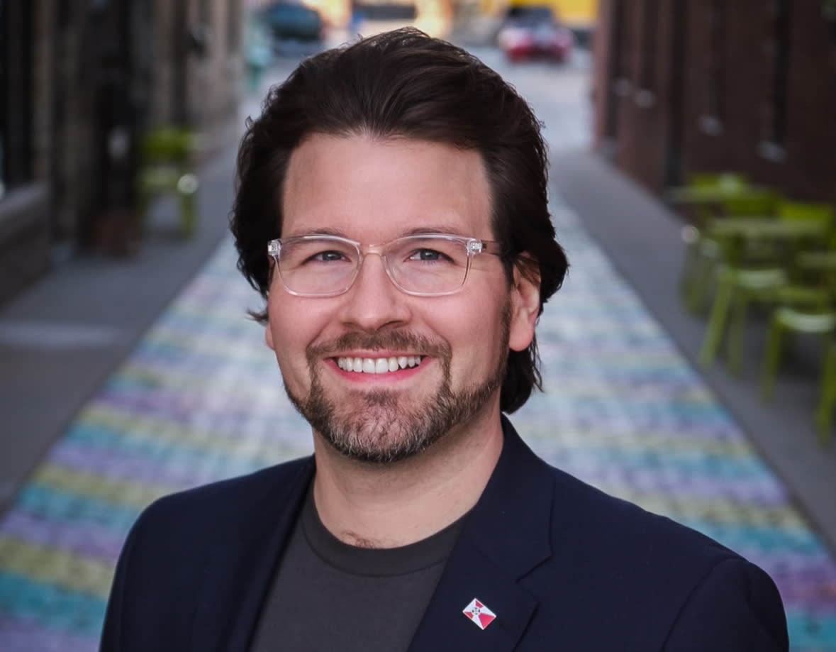 Chris Pumpelly, founder and CEO of Proud of Wichita, poses for a headshot in downtown Wichita