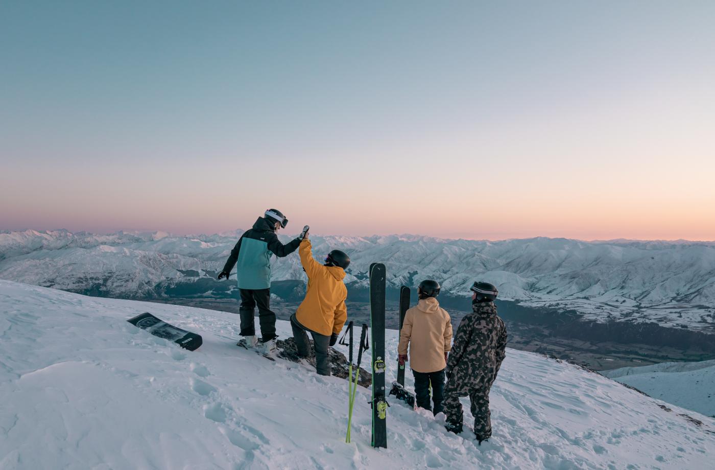 Group of skiers and snowboarders at the top of The Remarkables