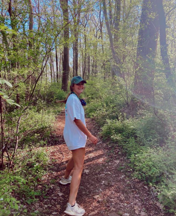 Smiling young lady on a hiking trail near Princeton, NJ.