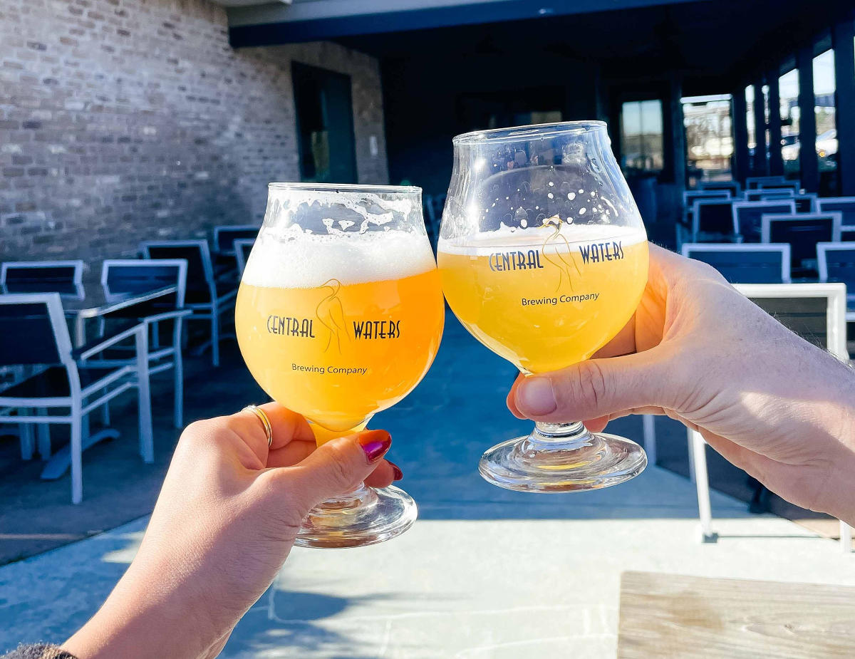 Central Waters beers outside cheersing