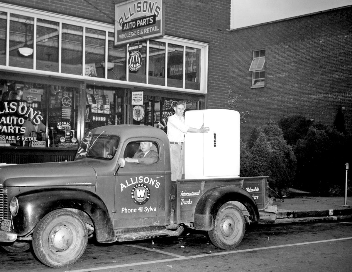 Allison’s Westinghouse pickup truck carrying a refrigerator in front of Allison’s Auto Parts on Main Street in Sylva, NC, in 1941
