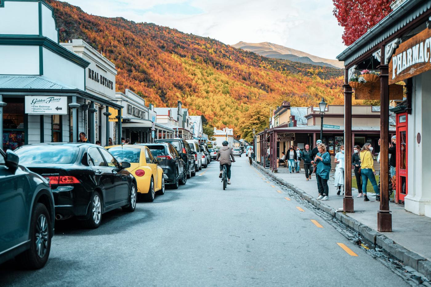 Person biking in Arrowtown during Autumn