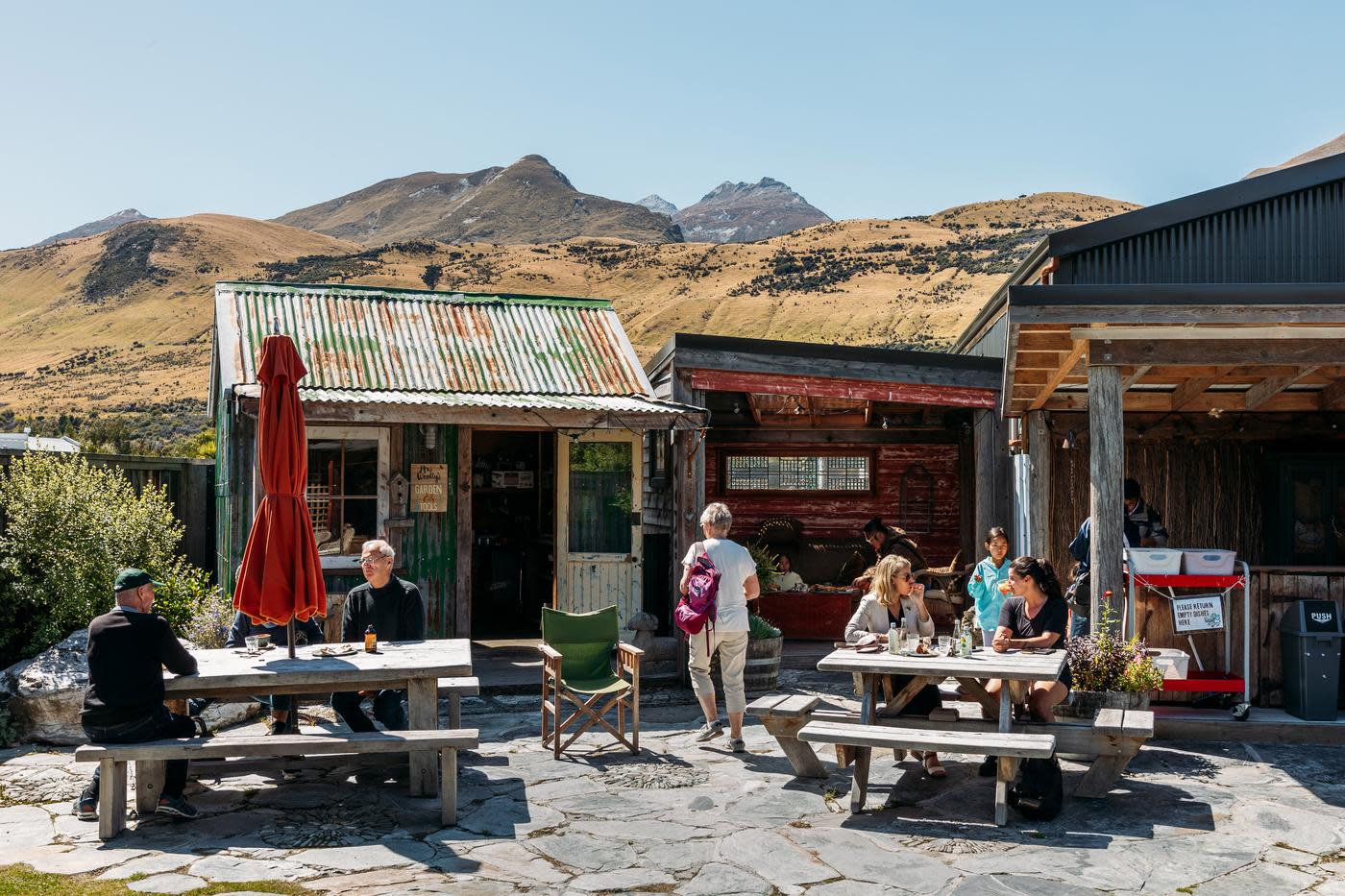 A group of people enjoying a beautiful day in Glenorchy at Mrs Wooly's General Store
