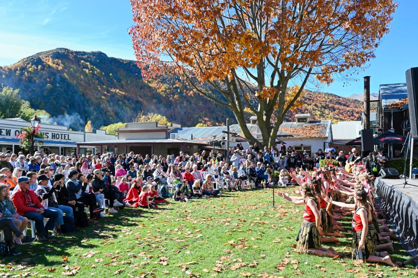 Crowd attending cultural performance at the Arrowtown Autumn Festival